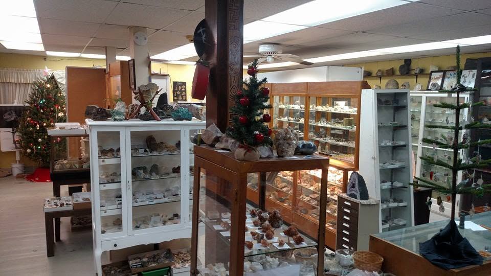 The interior of Apple Valley Minerals, filled with old wooden and glass specimen cases