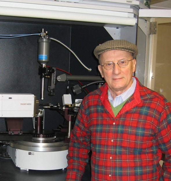 Sal Avella beside laboratory equipment